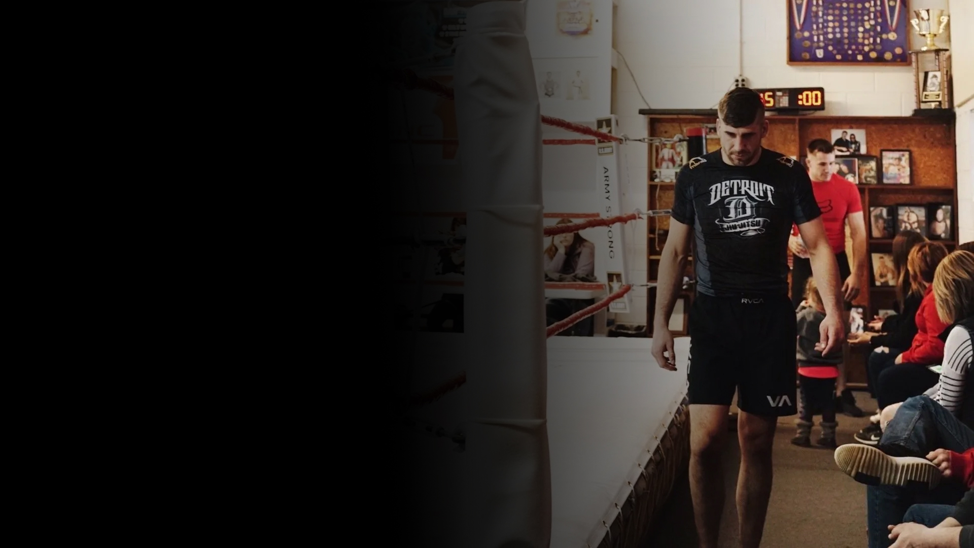 Charlie Walking Next to a Boxing Ring